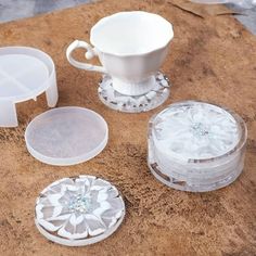 several pieces of glass sitting on top of a wooden table