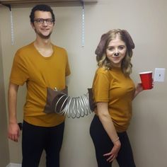 a man and woman dressed up as star wars characters holding coffee cups in their hands