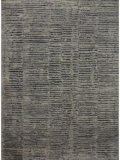 an area rug that has been made with grey and black stripes on the ground,