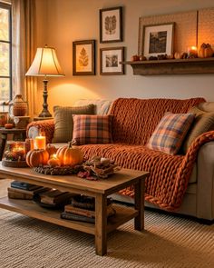 a living room filled with furniture covered in pumpkins and other fall decorating items