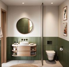 a bathroom with green tile walls and white toilet, sink, mirror and shower stall