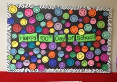 a bulletin board that says happy 100th day of school