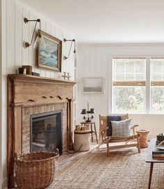 a living room filled with furniture and a fire place in front of a large window