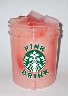 a pink drink in a plastic cup with the words pink drink on it's lid