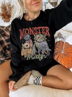 Show off your spooky aesthetic in our trendy monster mash shirt. This retro halloween sweatshirt is slightly distressed and oversized, perfect for a cozy fall outfit. * Ultra soft * Distressed design * Pre-shrunk * Universal fit * True to size * DTG Printing * Brand - Gildan Refunds/Exchanges: * No Cancellations * No returns/exchanges * All sales are final Sizing: Our graphic tees and sweatshirts are a true to size standard unisex fit. For an oversized look, please size up. For a TShirt dress fi Oversized Punk Halloween Sweatshirt, Oversized Punk Sweatshirt For Halloween, Punk Halloween Sweater For Streetwear, Halloween Punk Style Streetwear Sweater, Punk Style Crew Neck Top With Cartoon Print, Halloween Punk Long Sleeve Sweater, Grunge Halloween Sweater For Streetwear, Grunge Long Sleeve Tops For Halloween, Oversized Grunge Halloween Sweater