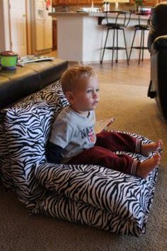 a toddler sitting in a zebra print bean bag chair with text that reads, these are so easy to do with pillows and cases they can fold into chairs