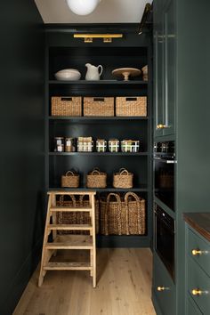 an open pantry with baskets on the shelves