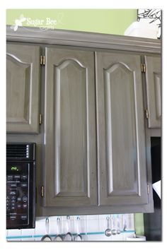 a microwave and cabinets in a kitchen