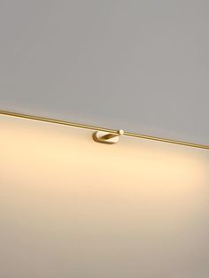 a close up of a light fixture on a wall