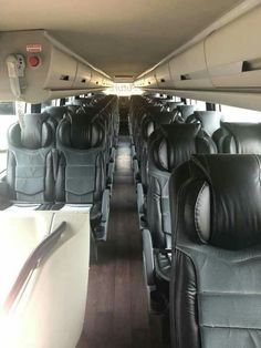 the inside of an airplane with black leather seats