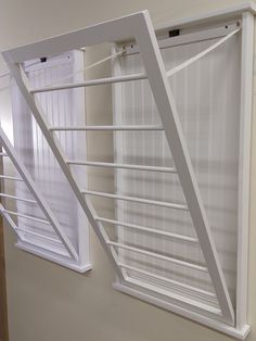 an open window with white shutters in a room