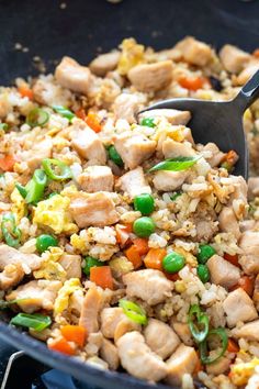 a skillet filled with chicken and rice