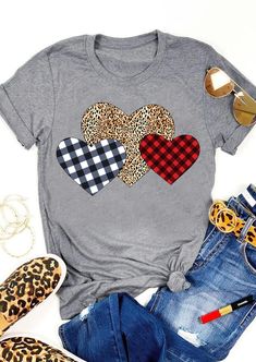 a gray shirt with leopard print hearts on the front and plaid heart patches on the back