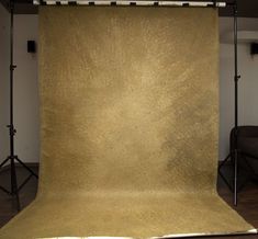 an image of a photo studio setting with lighting and backdrops on the floor in front of it