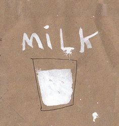 a piece of paper with the words milk written on it