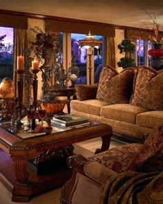 a living room filled with lots of furniture and windows covered in curtains next to each other