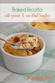 baked ricotta with spinach and sun - dried tomatoes in a white bowl on a checkered tablecloth