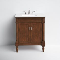 a bathroom vanity with a sink and faucet on it's side, against a white wall