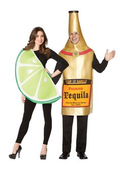 two people dressed in costumes standing next to each other and one is holding a bottle