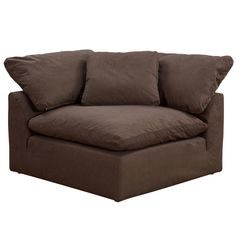 a brown couch with four pillows on it's back and one arm folded down