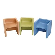 three plastic chairs sitting next to each other