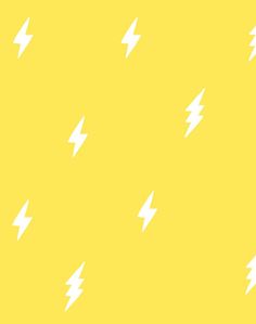 a yellow background with white lightnings on it