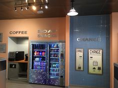 the interior of a coffee shop with two vending machines