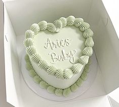 a heart - shaped cake in a box with the words ava's baby written on it