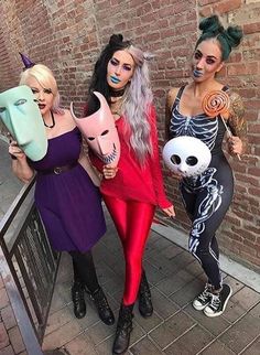 three women dressed up in halloween costumes