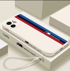 an iphone case with a red, white and blue stripe on the back is plugged in