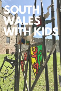 the words south wales with kids are in front of an iron sculpture