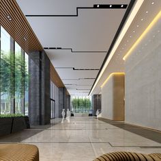 an empty lobby with large windows and wooden benches