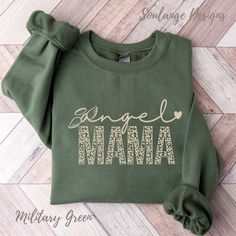 Welcome Friends, A cute Angel Mama design.  Angel Mama  This Bereavement Angel Mama crewneck sweatshirt is a pre-shrunk, classic-fit sweater that's made with air-jet spun yarn for a soft feel and reduced pilling. The design is direct to garment printed onto a Gildan 18000 UNISEX Sweatshirt. This item ships within 3-7 days from the purchase date. See product images for the sizing chart. Expressive designs to gift wear and love Perfect gift, ★Free Shipping★ Soulange Designs loves sharing designs t Mama Of An Angel, Mommy Of An Angel, Angel Mama Shirt, Angel Mama, Angel Wings Hoodie, Angel T-shirts, Angel Mom, Child Loss, Pregnancy Loss