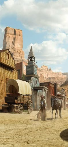 an old western town with horses and wagons