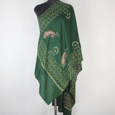 Kashmiri sozni Embroidered Wool Stole.This Multi Color Stole Is Made Of Fine Merino Wool Its Embroidered With Multi Colours.The Embroidery Done On This Is A Traditional Kashmiri Embroidery Known As 'sozni Work''.Now Own A Rare Genuine Kashmiri Hand Embroidered Stole Which Takes Many Months To Create, Unique In Design And Colour And, Have Never Been Replicated. Condition: Brand New Size: 28" X 80" (70 Cm X 200 Cm) Approx Colour: Green Style: Scarf Wrap Material: Fine Merino Wool Embroidery:  sozni Work (needle work) Washing : Hand Wash Only (Use Cold Water) Ironing: Use Steam Ironing Free Shipping : Yes Bohemian Pashmina Shawl With Intricate Embroidery For Eid, Multicolor Embroidered Pashmina Shawl With Zari Work, Festive Bohemian Pashmina Shawl With Resham Embroidery, Embroidered Silk Shawl For Eid, Festive Embroidered Jamawar Fabric, Eid Intricate Embroidery Pashmina Shawl, Bohemian Green Pashmina Shawl In Traditional Drape, Festive Bohemian Pashmina Shawl With Chikankari Embroidery, Bohemian Pashmina Shawl With Chikankari Embroidery For Festive Occasions