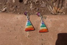 This beautiful earring is handmade by the beautiful Quechua people of the Peruvian Andes. It is made by silver and natural semiprecious gemstones and sacred shells of the region.(crystacola / peruvian turquiose, lapiz azul, spondillus, mother of pearlWeight : 4.7 grWidth : 1.5 cmHeight : 1.9 cmHeight with hook : 3.3 cmIt is handmade in 950 silver with inlaid stone and shell by a local family of jewelry artesians. Bohemian Sterling Silver Gemstone Earrings, Bohemian Sterling Silver Earrings With Natural Stones, Bohemian Multicolor Gemstone Earrings, Bohemian Multicolor Multi-stone Earrings, Bohemian Multicolor Pendant Earrings, Bohemian Multi-stone Dangle Earrings, Rainbow Bohemian Sterling Silver Jewelry, Rainbow Sterling Silver Bohemian Jewelry, Handmade Rainbow Sterling Silver Earrings