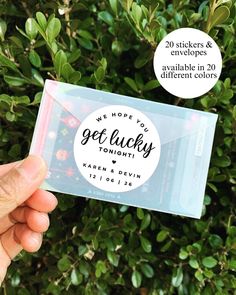 someone holding up a sticker that says we hope you get lucky tonight with the envelope