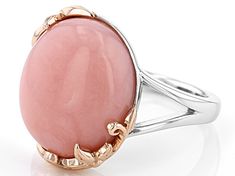 16x12mm oval pink opal rhodium and 18k rose gold over sterling silver solitaire ring. Measures approximately .55"L x .68"W. Not sizeable. Finished under gallery. Elegant Pink Opal Jewelry For Formal Occasions, Elegant Formal Pink Opal Jewelry, Elegant Pink Opal Ring In Sterling Silver, Elegant Pink Opal Sterling Silver Ring, Elegant Rose Gold Pink Opal Jewelry, Elegant Pink Opal Oval Jewelry, Pink Oval Opal Ring In Sterling Silver, Rose Gold Pink Opal Round Jewelry, Rose Gold Pink Opal Jewelry