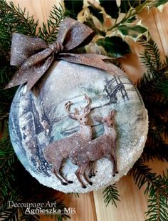 a christmas ornament with two deers on it