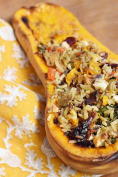 the stuffed squash is filled with rice and vegetables