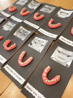 several pieces of paper with pictures of teeth on them