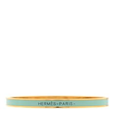 This is an authentic HERMES Enamel Extra Narrow Uni Bracelet size 62 in Aqua. This stylish narrow bracelet is crafted of gold plated trim with an enameled turquoise inlay with a black enameled interior. Hermes Bracelet, Hermes Jewelry, Black Enamel, Bracelet Sizes, A Black, Bangles, Turquoise, Trim, Things To Sell