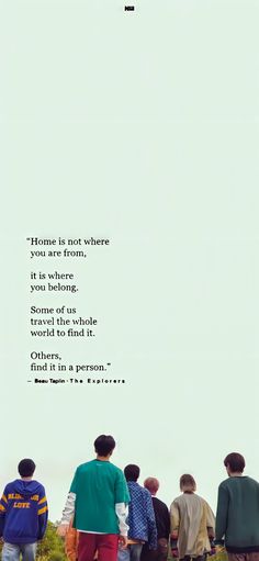 a group of people standing next to each other in front of a sky with the words home is not where you are, it is where you belong