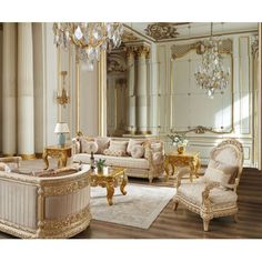 an elegant living room with gold furniture and chandelier