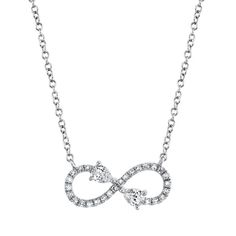 Crafted in 14k white gold, this gorgeous infinity symbol necklace is traced in brilliant round diamonds and accentuated by two dazzling pear-cut diamonds.  Total diamond weight is .22 carats. Infinity Symbol Necklace, Diamond Infinity Necklace, Infinity Necklace Gold, Loop Pendant, Infinity Pendant, Pear Cut Diamond, Infinity Necklace, Gold Diamond Necklace, Pear Shaped Diamond