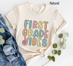 First Grade Vibes Shirt, Retro First Grade Teacher Shirt, 1st Grade Team Shirts, Back to School Shirt, Kids First Day of First Grade Tee More Grades and Styles Here: https://www.etsy.com/shop/TheGraphicPeach?ref=seller-platform-mcnav§ion_id=34195008 For environmental and human friendly reason, this product is only made when you order. Turnaround time is usually 1-5 business days before shipping, but can increase during holiday periods. Our professional printers always strive to ship as quickly a Third Grade Teacher Shirts, Teacher Team Shirts, Back To School Shirts, Third Grade Teacher, Tshirt Design Ideas, Teacher Team, Second Grade Teacher, Cricut Projects Vinyl, Team Shirts