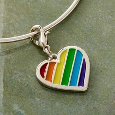 "Buy the Charmalong™ Rainbow Heart Charm by Bead Landing™ at Michaels. This lovely rainbow heart charm by Bead Landing will be perfect to make a personalized jewelry design. This lovely rainbow heart charm by Bead Landing will be perfect to make a personalized jewelry design. You can place it on your charm bracelet with other matching charms for a fun and unique accessory. Details: Multicolor 1.5\" x 1.5\" x 0.25\" (38.1mm x 38.1mm x 6.3mm) Zinc alloy, iron and epoxy | Charmalong™ Rainbow Heart Gift Rainbow Jewelry With Heart Beads, Rainbow Heart Beads Jewelry Gift, Rainbow Heart Beads Jewelry For Gift, Everyday Multicolor Jewelry With Heart Charm, Sterling Silver Multicolor Jewelry With Heart Charm, Rainbow Heart Charm Jewelry For Valentine's Day, Multicolor Heart-shaped Charms Jewelry, Multicolor Heart-shaped Charm Jewelry, Multicolor Heart-shaped Jewelry For Friendship