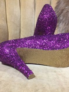 Royal purple covers the entire top portion of the heels while the underside is covered in an ultra-fine yellow gold glitter. These heels can be made in any color combo desired. If you would like another color combination please leave your color choices at checkout. This heel is available in additional colors and shoe styles. Contact us today for more color and style options. All heels are handmade and shipped out within 1-2 weeks of the purchase date. We always welcome new designs and love to wo Purple Platform Heels For Party, Glamorous Purple High Heels, Glamorous Purple Party Heels, Purple Glitter High Heels, Tall Heels, Heels Purple, Heels Short, Glitter High Heels, Short Heels