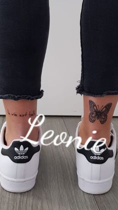 a person's feet with tattoos on them and the words peace written in white