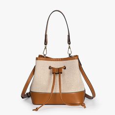 The Vintage Canvas Bucket Bag is a timeless classic made for everyday use.Made from our Premium Vegan Leather trim and canvas, it is durable and very light weight. It opens up to a roomy interior that will can easily fit all your everyday essentials. Comes with a short strap to carry as a handbag and long strap to sling. Giving you endless styling options. Perfect for work, travel or even just a casual day out.Details• 100% Vegan Leather• Lightweight Canvas• 7.8“W x 4.7“D x 7.8“H (20cm x 12cm x Canvas Bucket Bag, Lighted Canvas, Backpack Tote Bag, Vintage Canvas, Work Travel, Tote Backpack, Bag Straps, Timeless Classic, Leather Trims